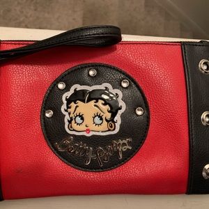 Betty Boop Wristlet/ Their is a few marks on them but they are small.
